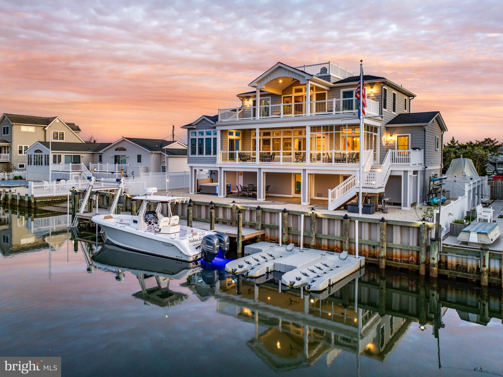 29 Amherst Road Long Beach Township, NJ 08006 - Photo 4 of 56 a roof deck with table and chairs