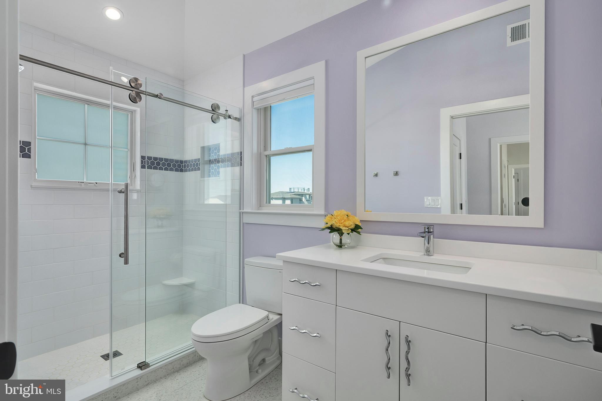 29 Amherst Road Long Beach Township, NJ 08006 - Photo 44 of 56 a bathroom with a granite countertop sink toilet and shower