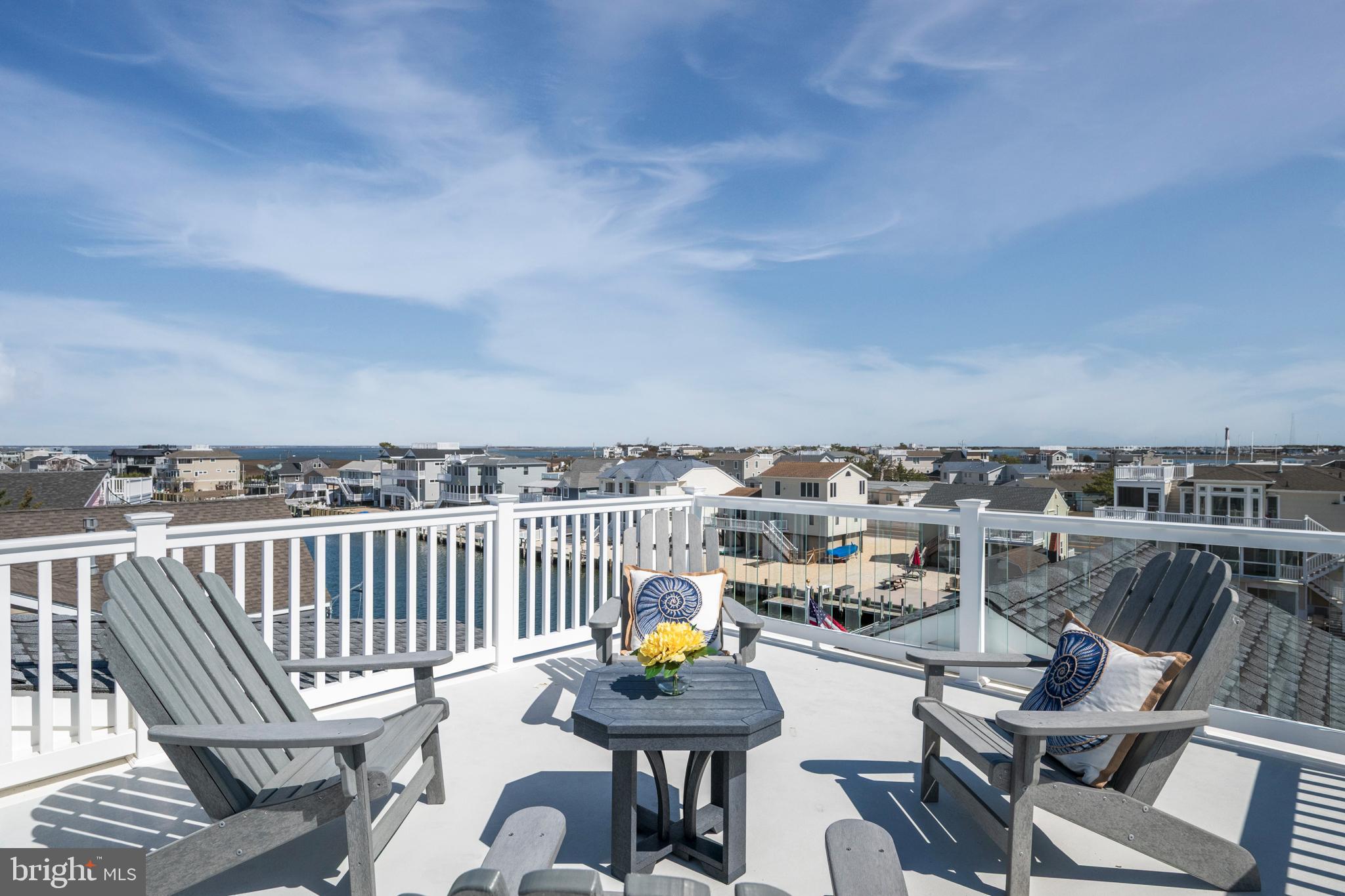 29 Amherst Road Long Beach Township, NJ 08006 - Photo 51 of 56 a view of a chairs and table on the roof deck