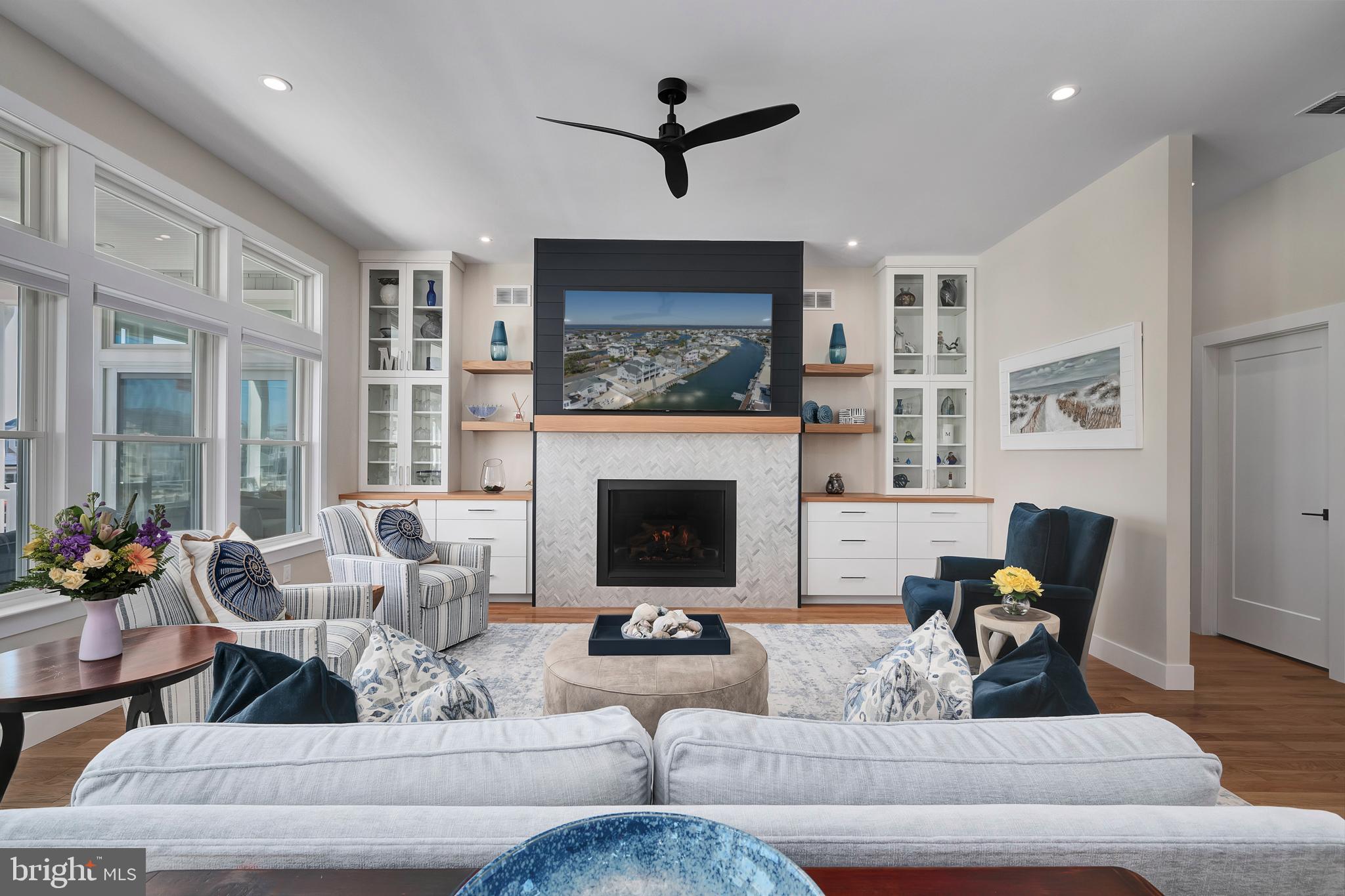 29 Amherst Road Long Beach Township, NJ 08006 - Photo 8 of 56 a living room with furniture a fireplace and a table