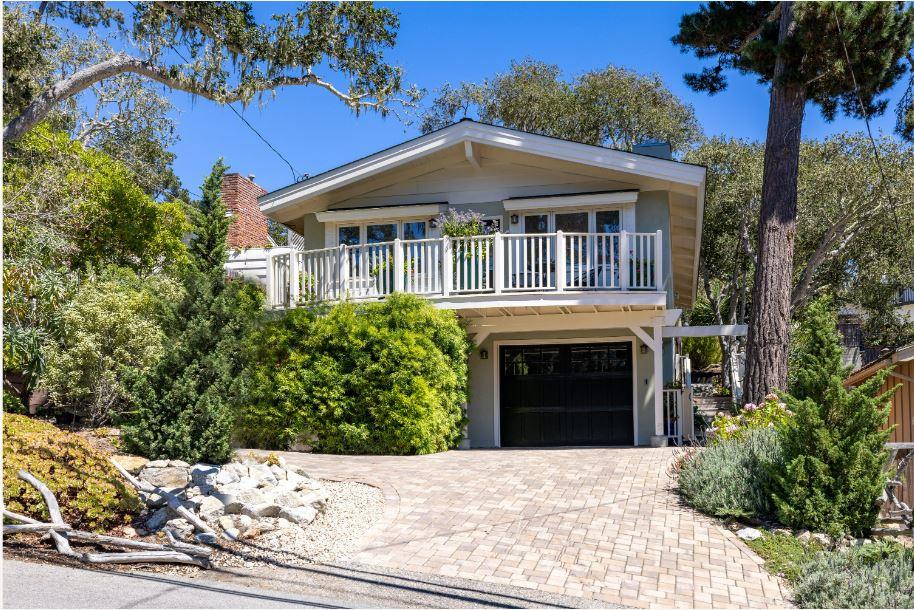 Junipero Street Carmel, CA 93921 - Photo 1 of 33 a front view of a house with a yard and garage