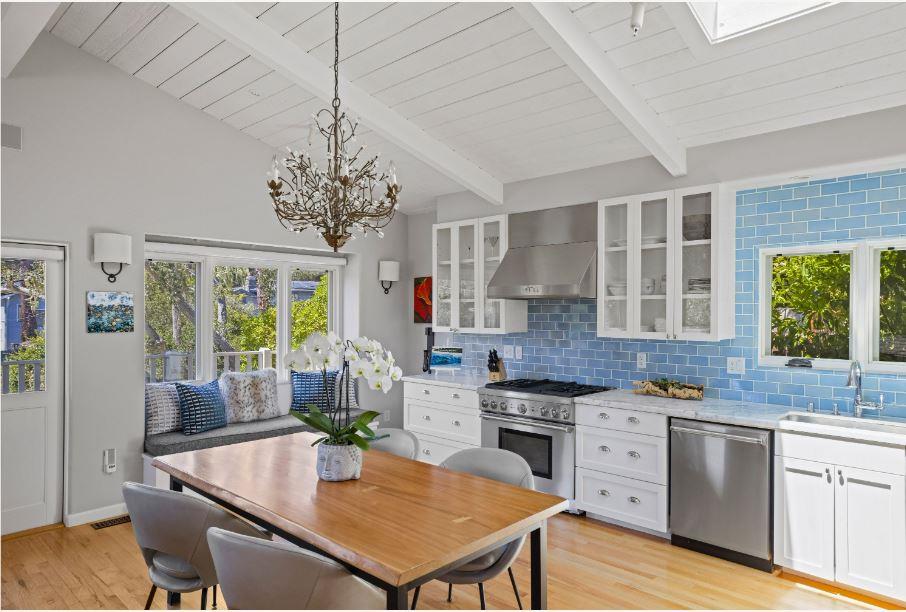 Junipero Street Carmel, CA 93921 - Photo 8 of 33 a kitchen with stainless steel appliances granite countertop a stove and cabinets