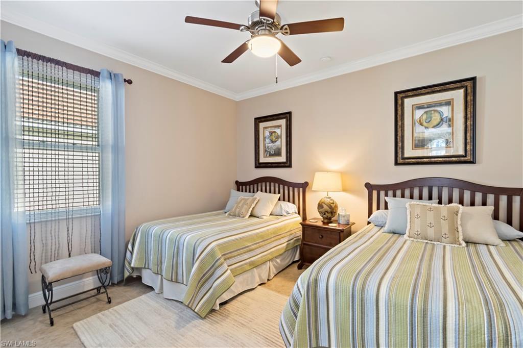 19912 Maddelena Circle Estero, FL 33967 - Photo 12 of 20 a bedroom with two beds and a chair