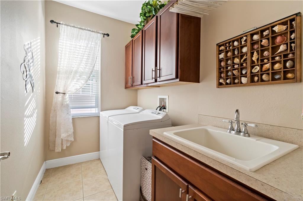19912 Maddelena Circle Estero, FL 33967 - Photo 14 of 20 a bathroom with a sink and a mirror