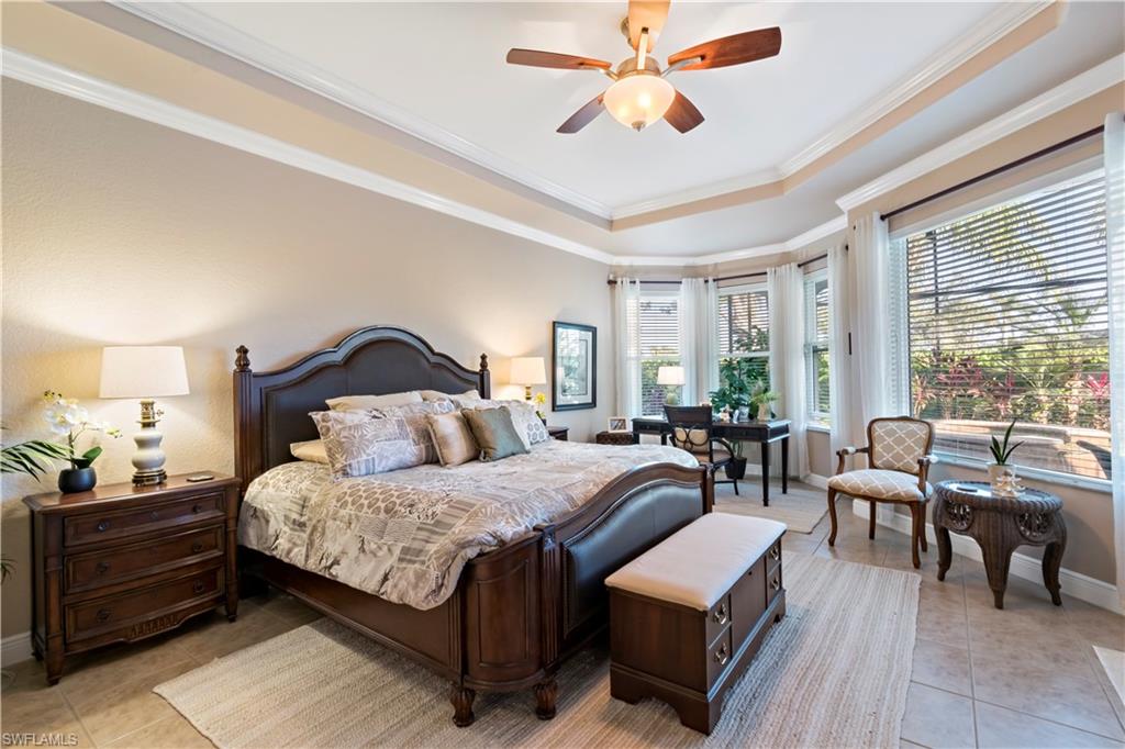 19912 Maddelena Circle Estero, FL 33967 - Photo 6 of 20 a bedroom with a bed and a chandelier