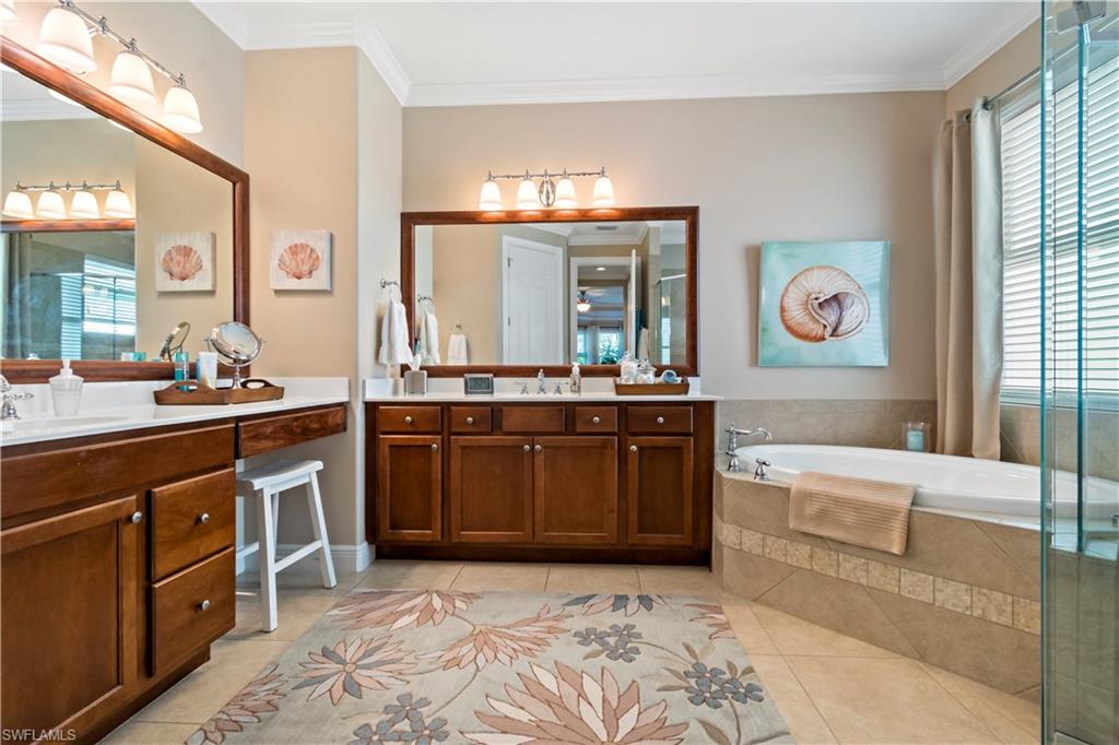 19912 Maddelena Circle Estero, FL 33967 - Photo 7 of 20 a spacious bathroom with a sink a vanity and a large mirror