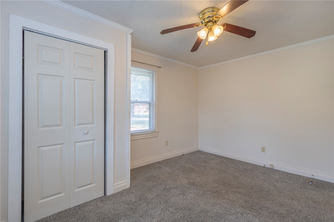 201 Blue Ridge Circle Belton, SC 29627 - Photo 11 of 30 Plush carpeting underfoot and crown molding detail define this comfortable bedroom space.