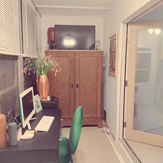 a workspace with furniture and window