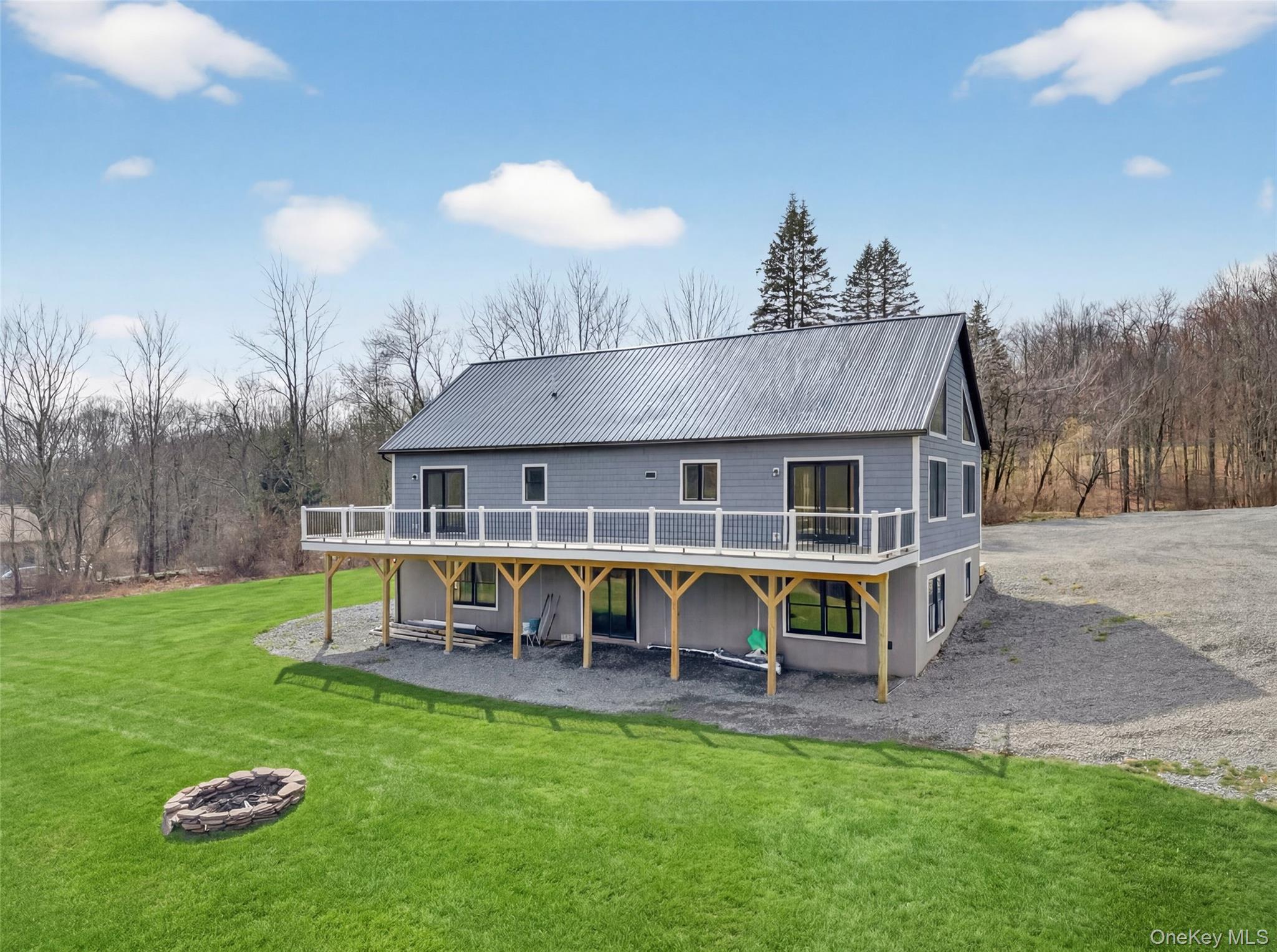129 Nelson Road Hankins, NY 12741 - Photo 27 of 31 a view of a house with a yard porch and sitting area