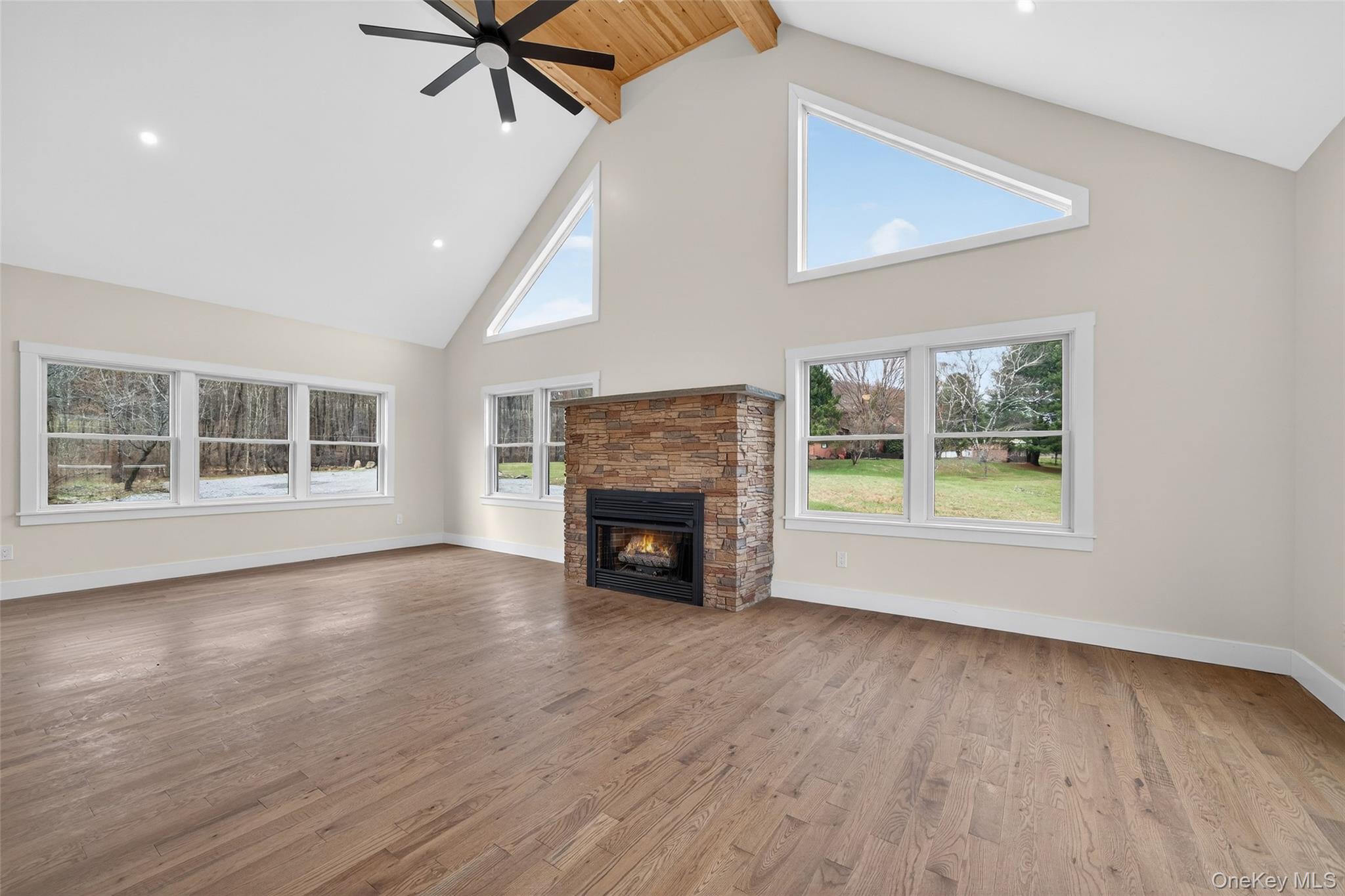 129 Nelson Road Hankins, NY 12741 - Photo 4 of 31 a view of an empty room with a window and fireplace