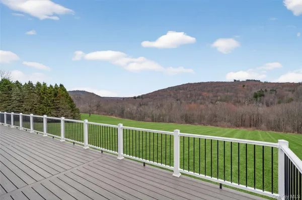 a view of a balcony with mountain view