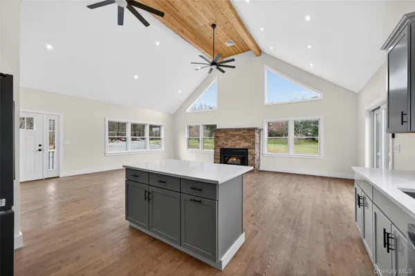 a kitchen with sink cabinets and wooden floor