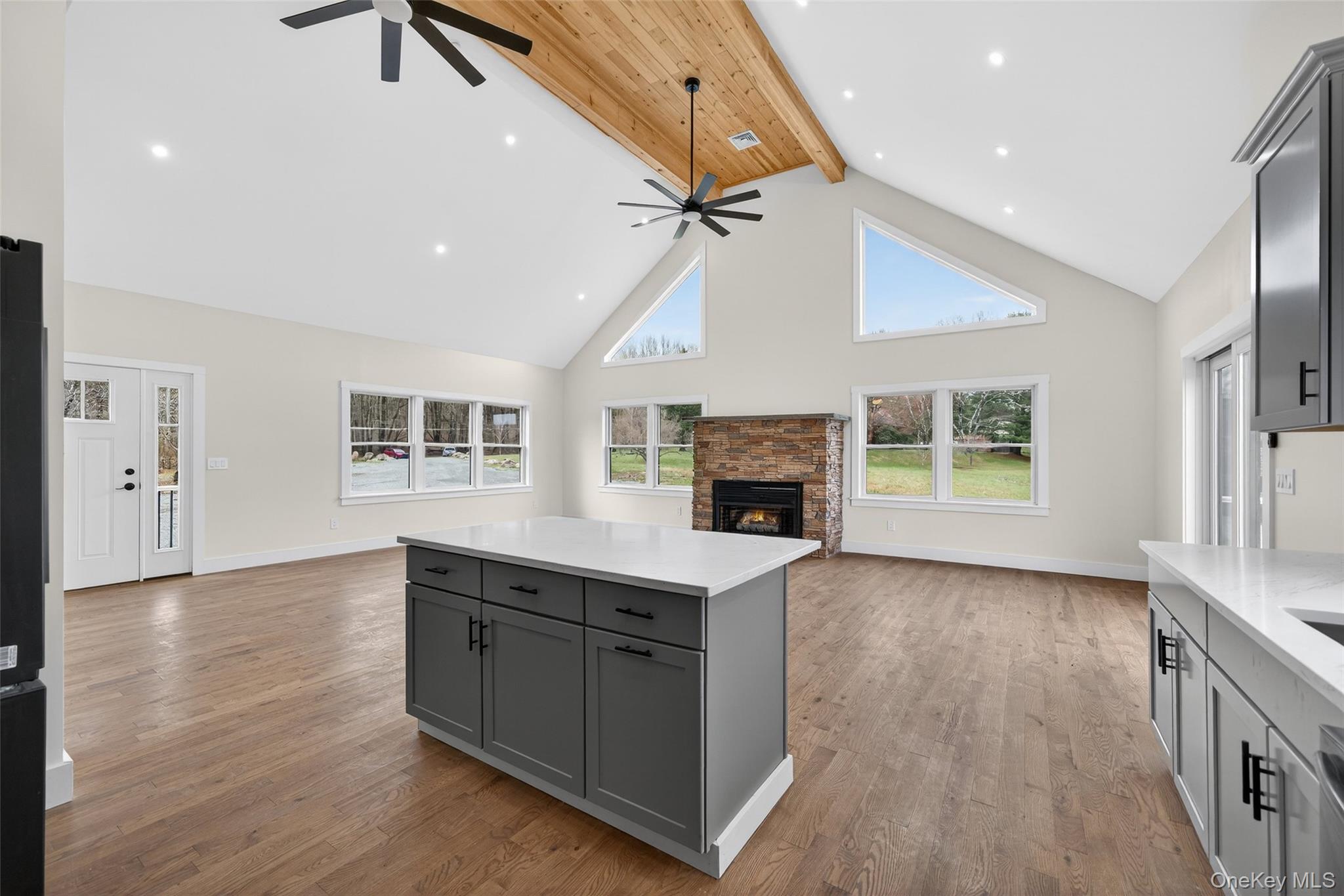 129 Nelson Road Hankins, NY 12741 - Photo 6 of 31 a kitchen with sink cabinets and wooden floor