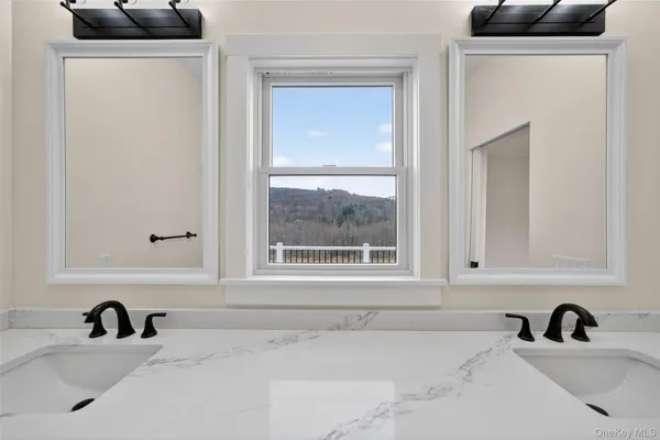 a bathroom with a sink and a window