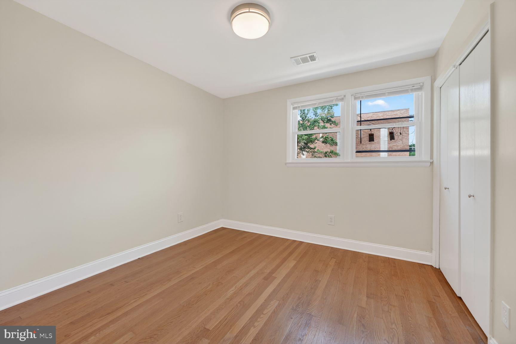 7205 Livingston Road Oxon Hill, MD 20745 - Photo 15 of 25 Bright and airy room with hardwood floors.