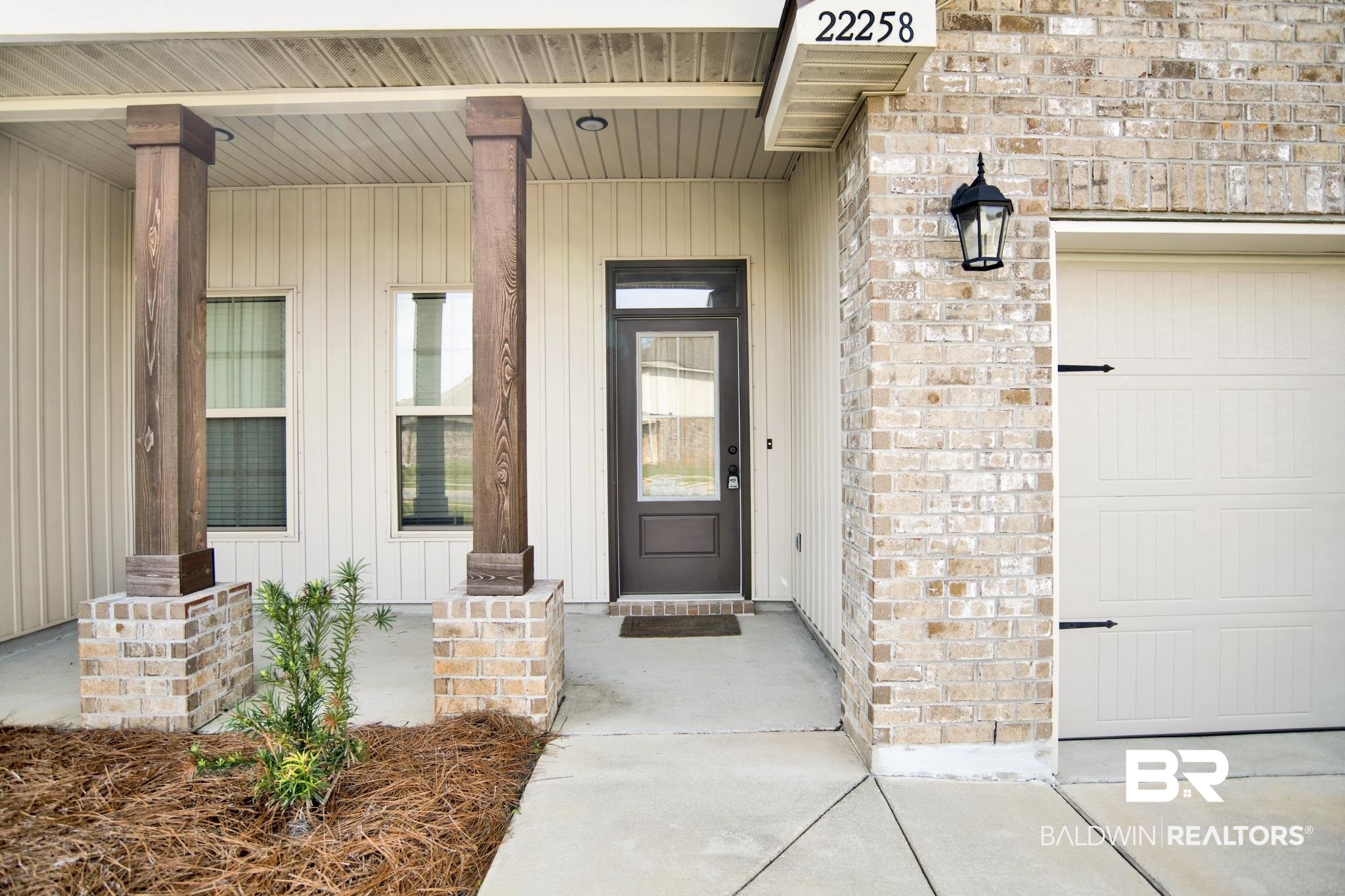 22258 Hibiscus Circle Foley, AL 36535 - Photo 4 of 26 Doorway to property featuring board and batten siding and a garage