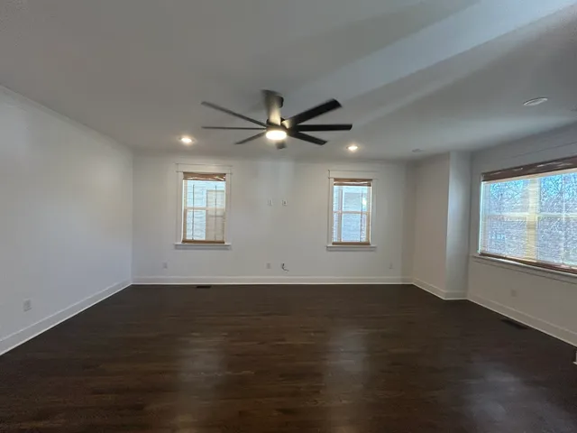 a bathroom with a sink mirror and toilet