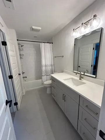 a view of an empty room with a fireplace