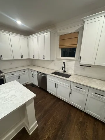 a view of kitchen with sink microwave and refrigerator