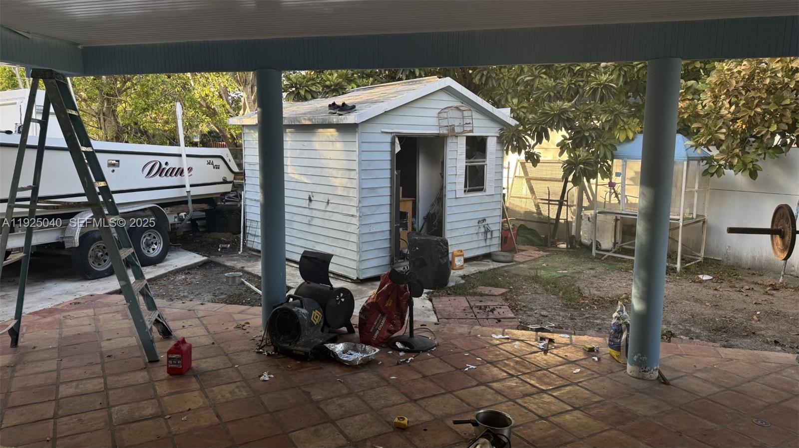 1550 Southwest 86th Court Miami, FL 33174 - Photo 5 of 6 a view of a house with backyard porch and sitting area
