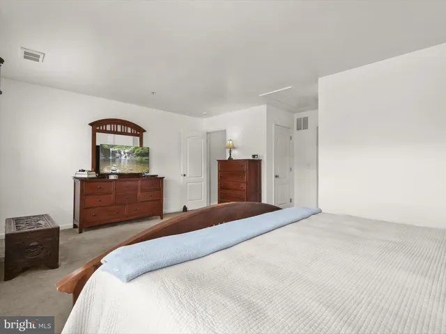 a bathroom with a sink a bathtub and a mirror