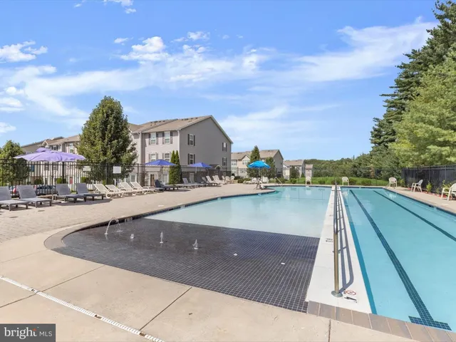 a wooden bench sitting in the middle of a park