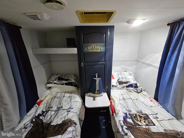 a bathroom with a sink toilet and mirror