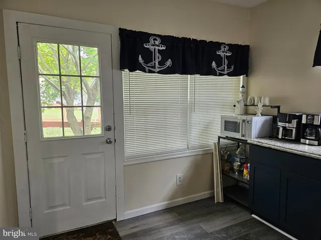 a kitchen with a refrigerator and cabinets