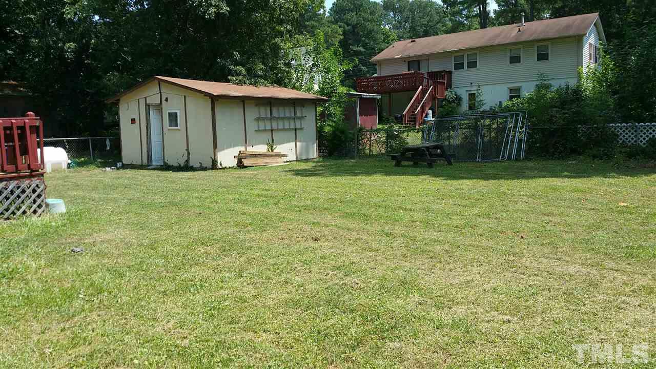 721 Cooper Road Raleigh, NC 27610 - Photo 22 of 22 a front view of a house with garden