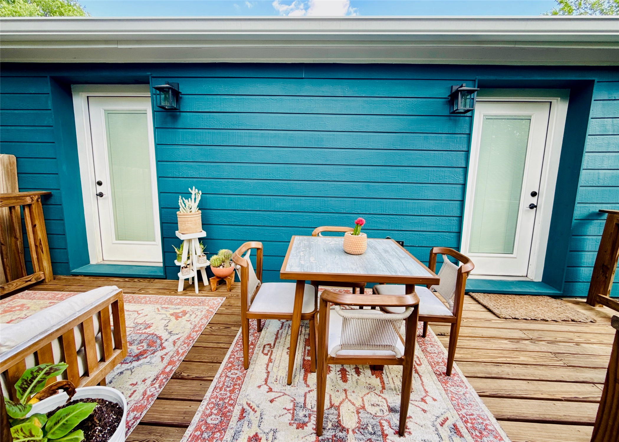 1616 Webberville Road, Unit A Austin, TX 78721 - Photo 28 of 35 The property features an exterior with blue siding and a wooden deck