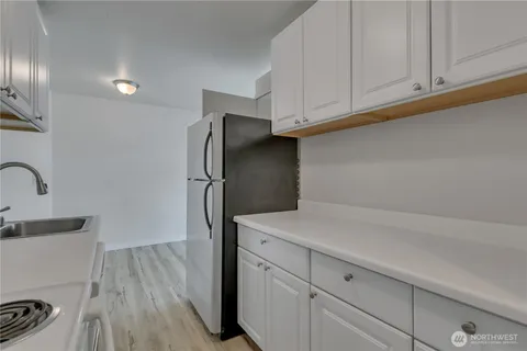 a kitchen with stainless steel appliances a refrigerator and a sink