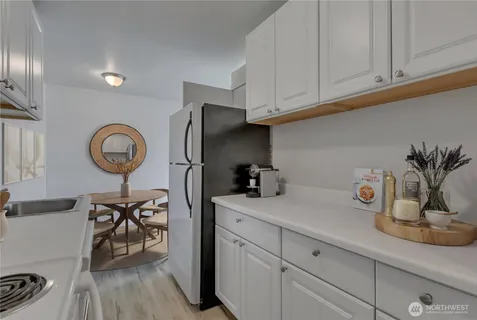 a kitchen with cabinets and window