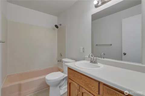 a bathroom with a sink toilet and a bathtub