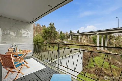a view of a balcony with chairs