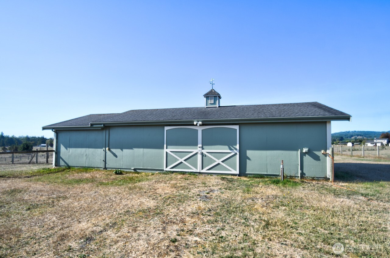 7737 Bordeaux Vista Road Southwest Olympia, WA 98512 - Photo 13 of 38 a house that has a lot of windows in it