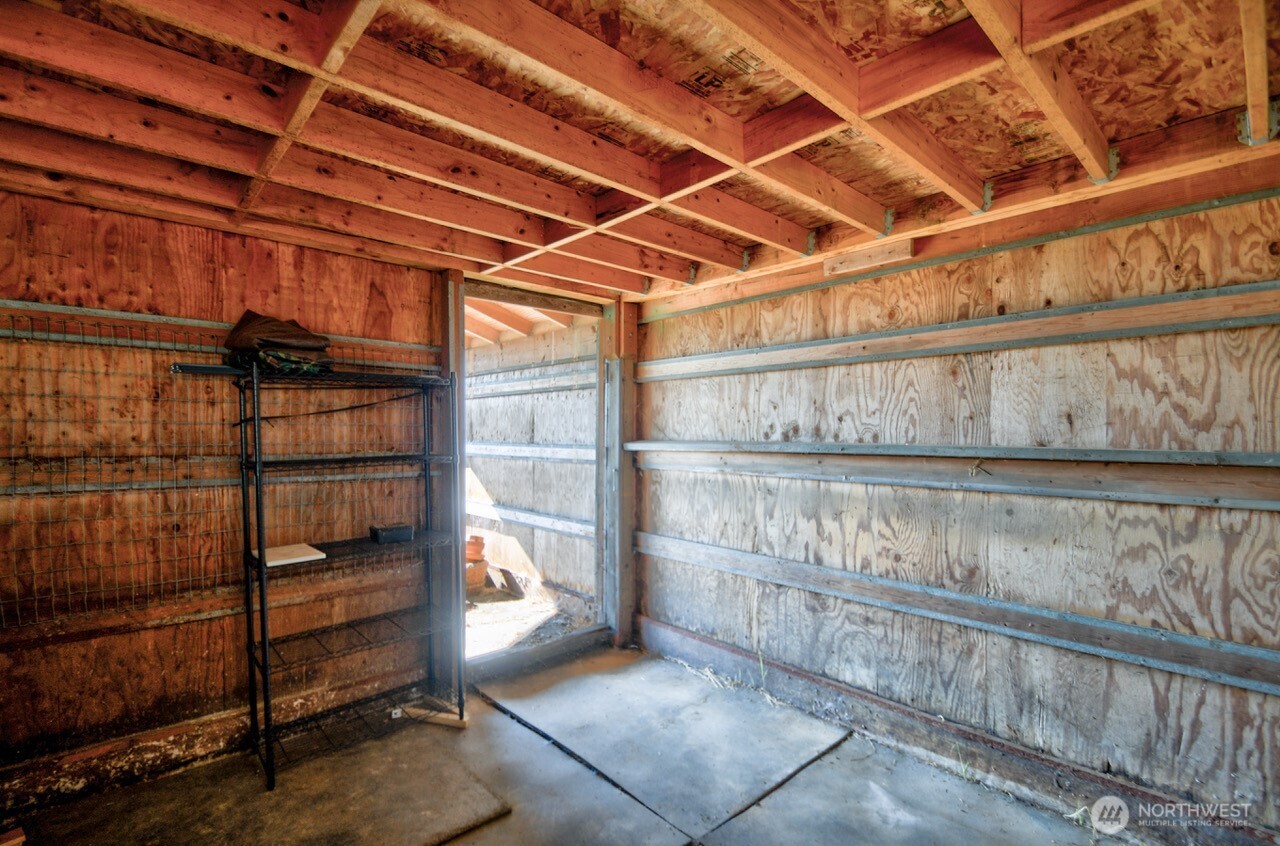 7737 Bordeaux Vista Road Southwest Olympia, WA 98512 - Photo 14 of 38 a view of store room with racks