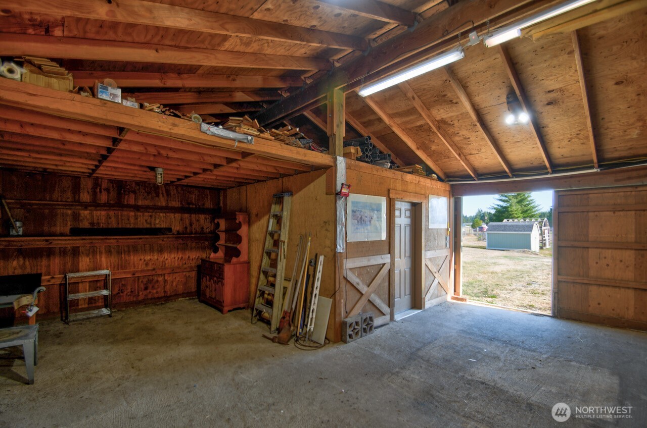 7737 Bordeaux Vista Road Southwest Olympia, WA 98512 - Photo 15 of 38 a view of empty room with wooden walls