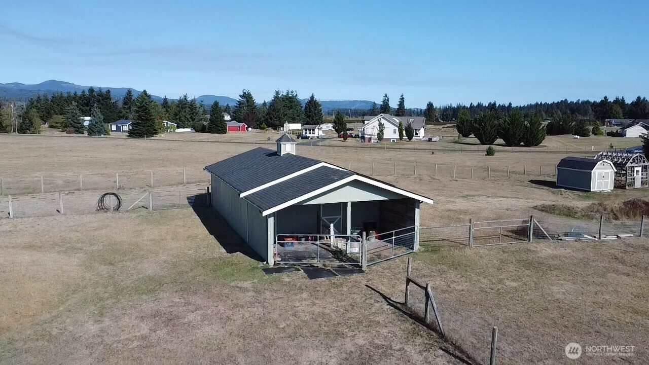 7737 Bordeaux Vista Road Southwest Olympia, WA 98512 - Photo 16 of 38 a view of a house with a yard