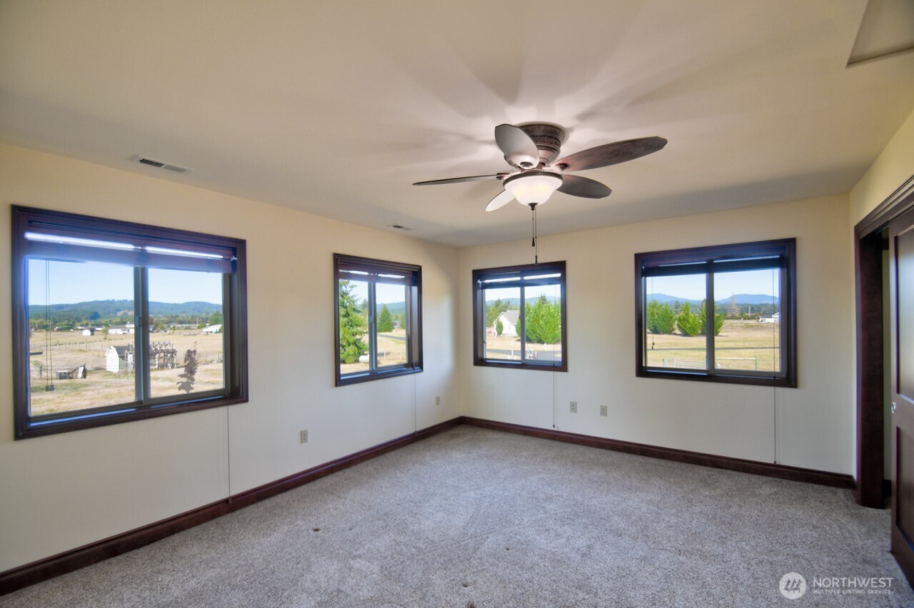 7737 Bordeaux Vista Road Southwest Olympia, WA 98512 - Photo 17 of 38 a view of an empty room with a window