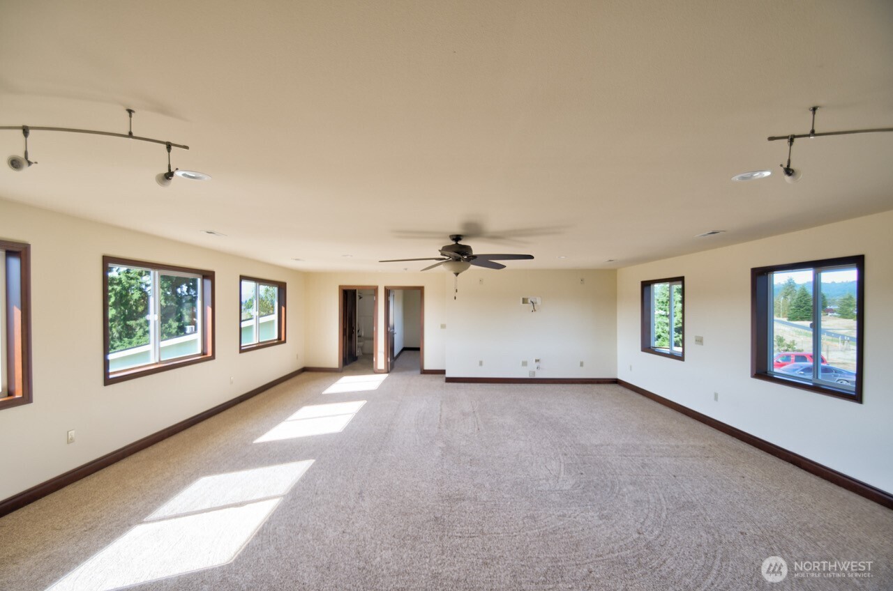 7737 Bordeaux Vista Road Southwest Olympia, WA 98512 - Photo 18 of 38 a view of a livingroom with an empty space and a window