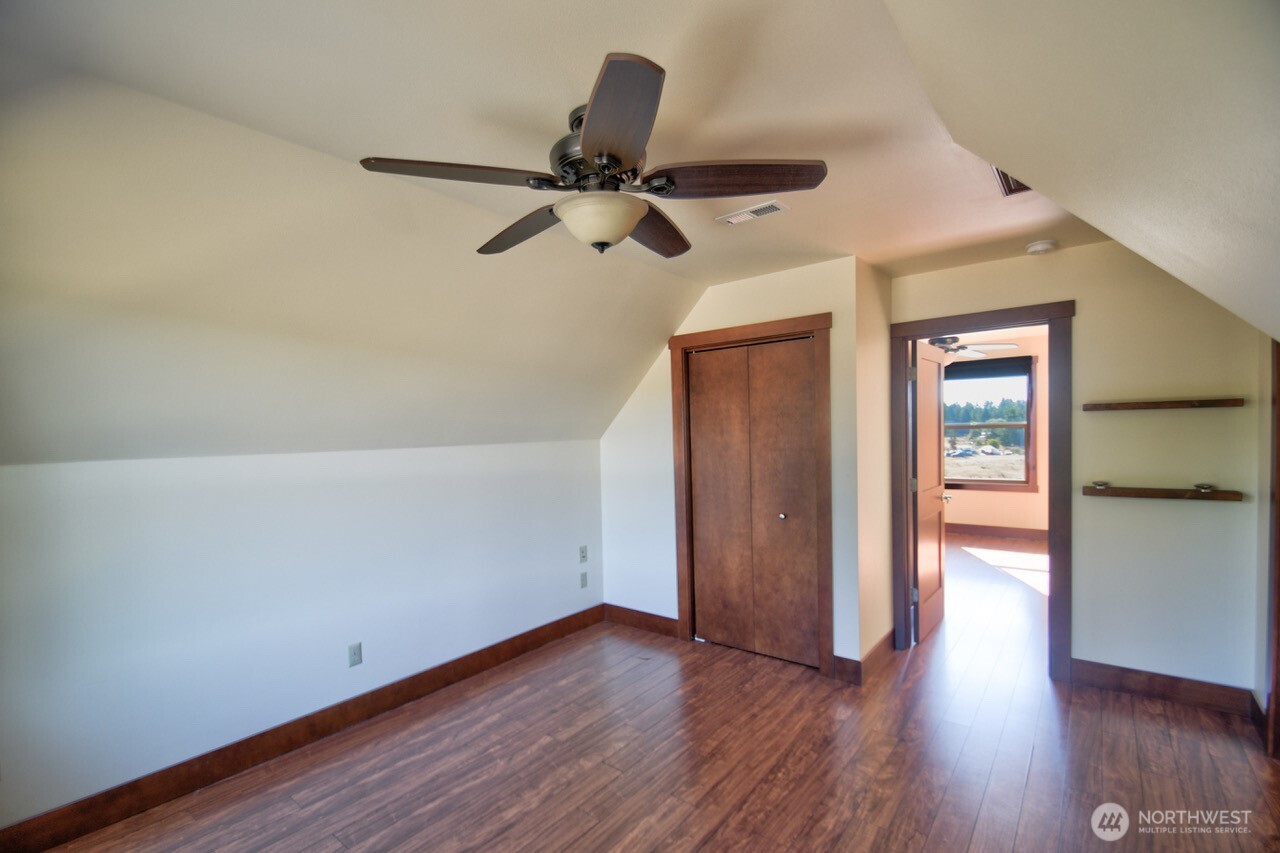 7737 Bordeaux Vista Road Southwest Olympia, WA 98512 - Photo 22 of 38 wooden floor in an empty room
