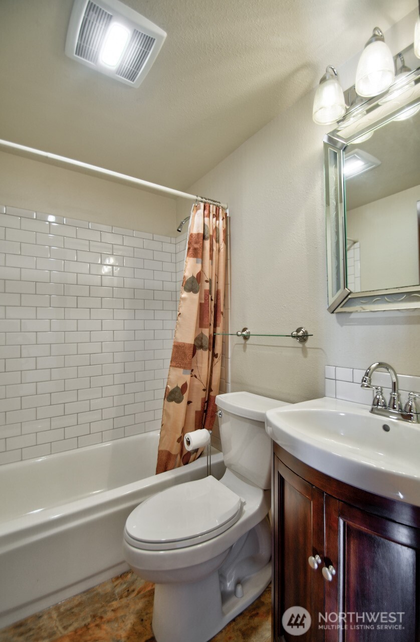 7737 Bordeaux Vista Road Southwest Olympia, WA 98512 - Photo 29 of 38 a bathroom with a sink toilet and shower
