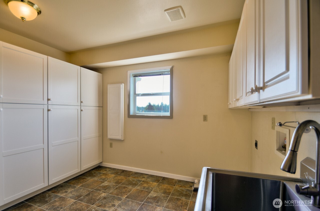 7737 Bordeaux Vista Road Southwest Olympia, WA 98512 - Photo 30 of 38 a view of a room with storage