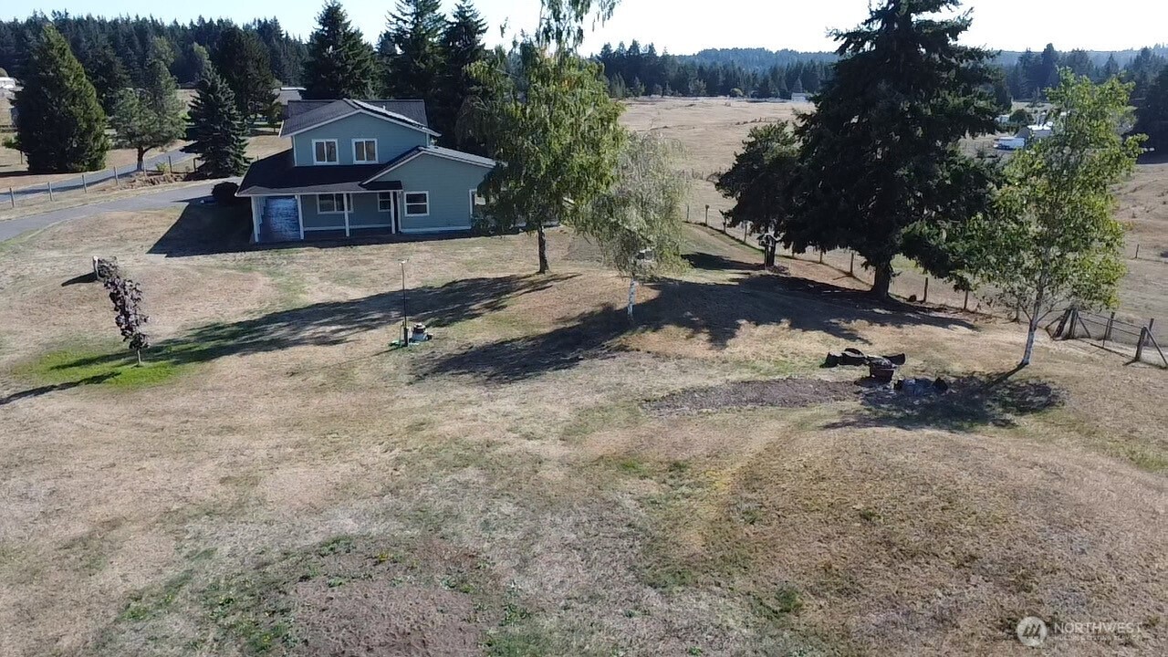7737 Bordeaux Vista Road Southwest Olympia, WA 98512 - Photo 38 of 38 a view of a house with a yard