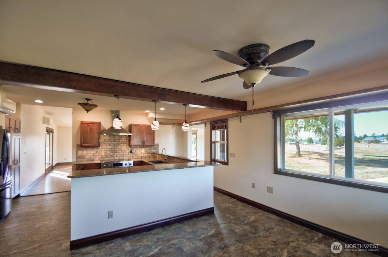 7737 Bordeaux Vista Road Southwest Olympia, WA 98512 - Photo 7 of 38 a very nice looking room with a large window