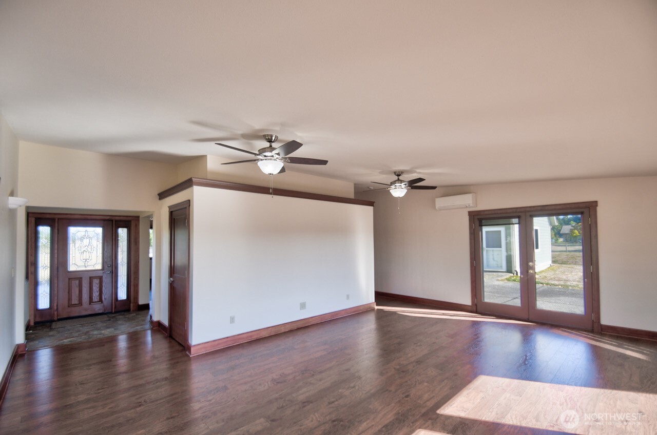 7737 Bordeaux Vista Road Southwest Olympia, WA 98512 - Photo 10 of 38 wooden floor in an empty room with a window