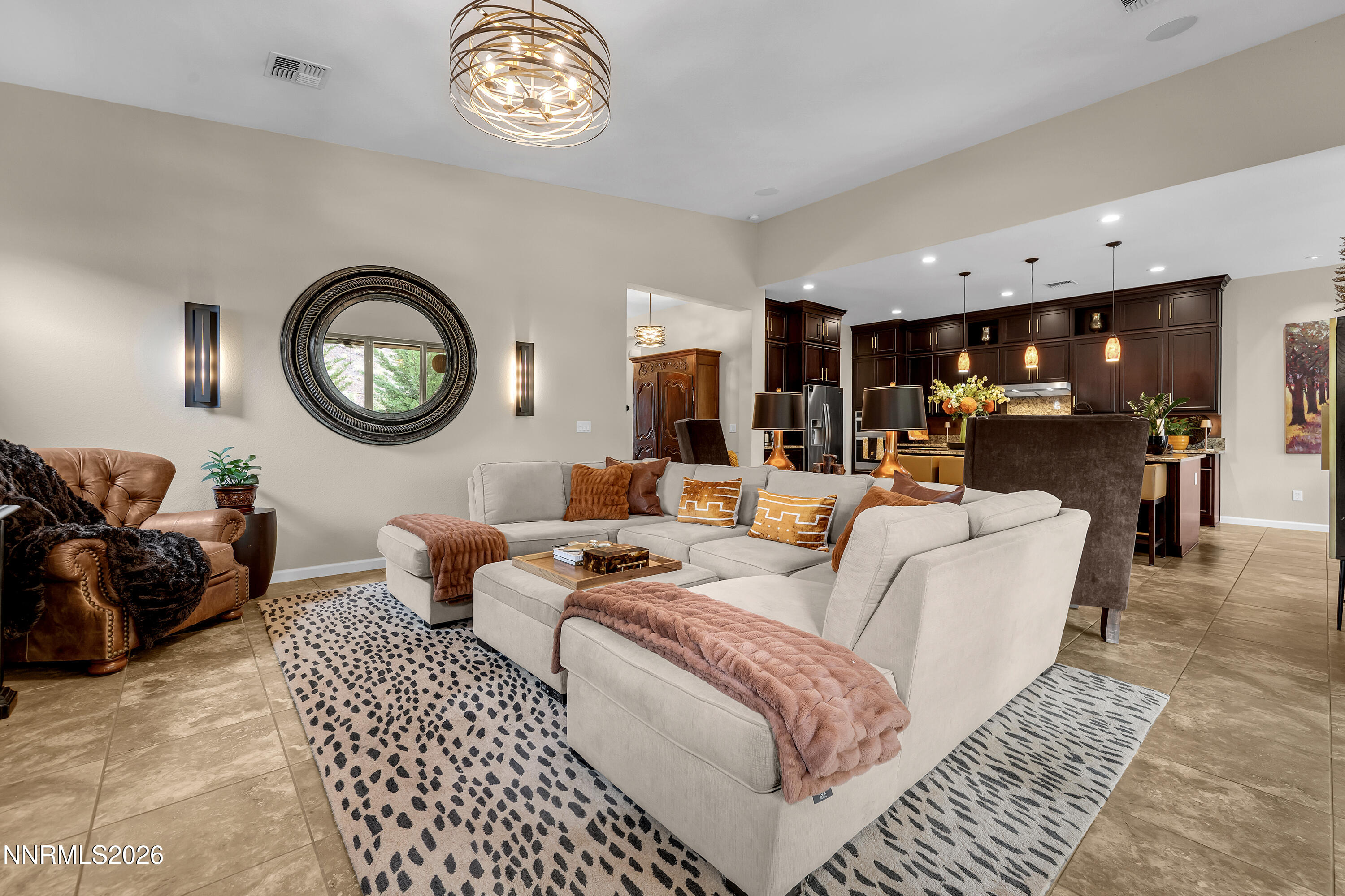 9021 Iron Sky Court Reno, NV 89523 - Photo 5 of 39 a living room with furniture a clock and a rug