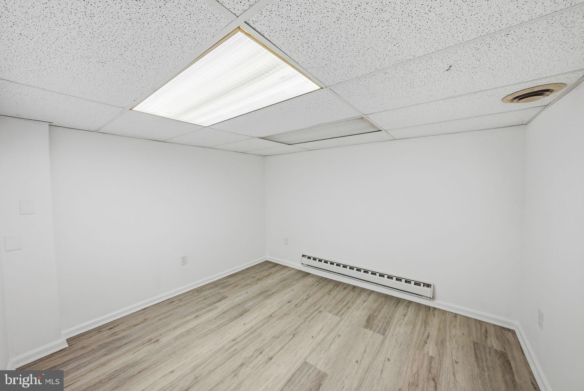 371 Bolton Road East Windsor, NJ 08520 - Photo 19 of 20 a view of a room with wooden floor and white walls