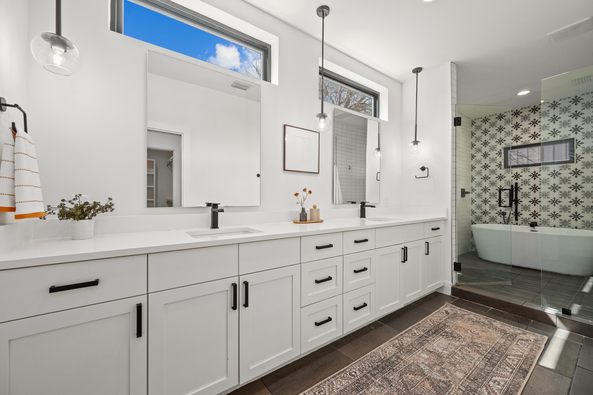 503 Havana Street, Unit A Austin, TX 78704 - Photo 12 of 28 Full bathroom featuring double vanity, a freestanding bath, and a shower stall