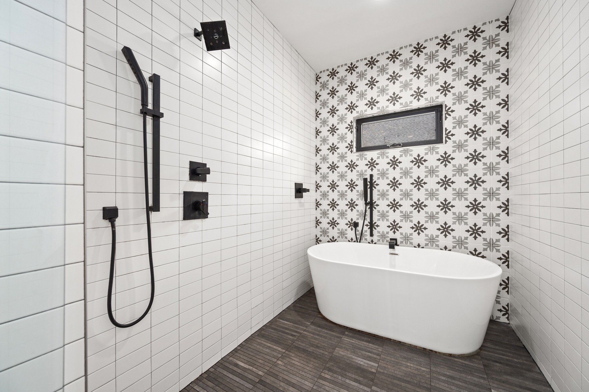 503 Havana Street, Unit A Austin, TX 78704 - Photo 13 of 28 Bathroom with tile walls, a freestanding bath, and a tile shower